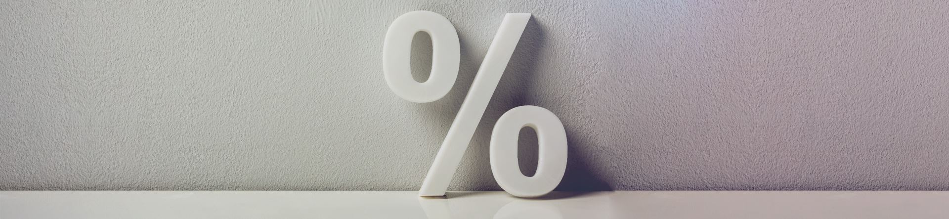 Símbolo de porcentagem representando os impostos sobre investimentos financeiros